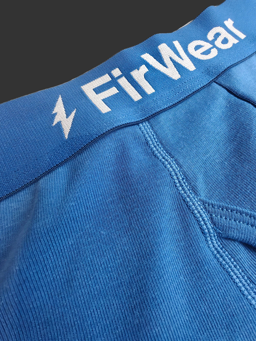 Blue fabric with 'FirWear' branding on a beige background